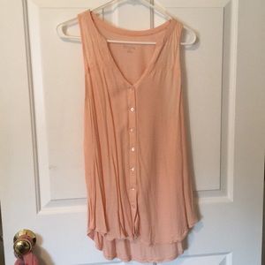 Pale pink sleeveless button down top